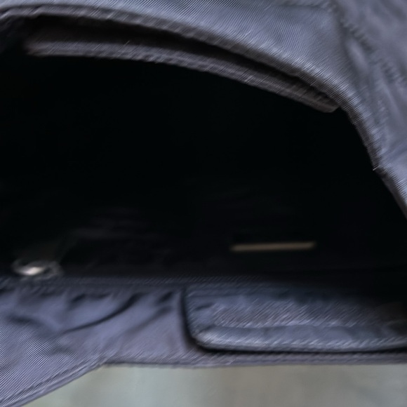 This is a black Prada crossbody with matching wallet. - Picture 3 of 8